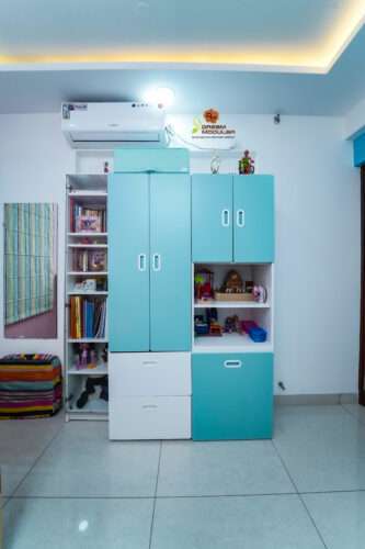 Wardrobe with small cabinets in children's bedroom