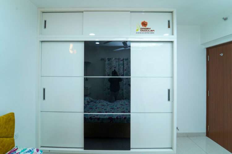 Sliding door interior design wardrobe with the color combination of white and black - Dream Modular