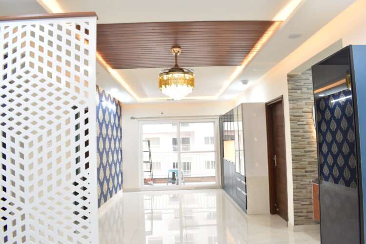 a hallway with a chandelier, Partition, False Ceiling, Crockery and a door - Dream Modular