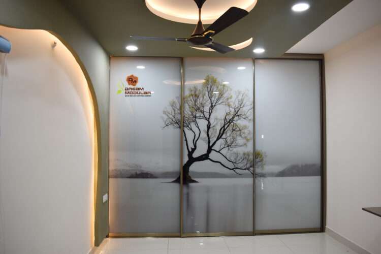 A room with Sliding door wardrobe with tree wallpaper on it and a false ceiling - Dream Modular