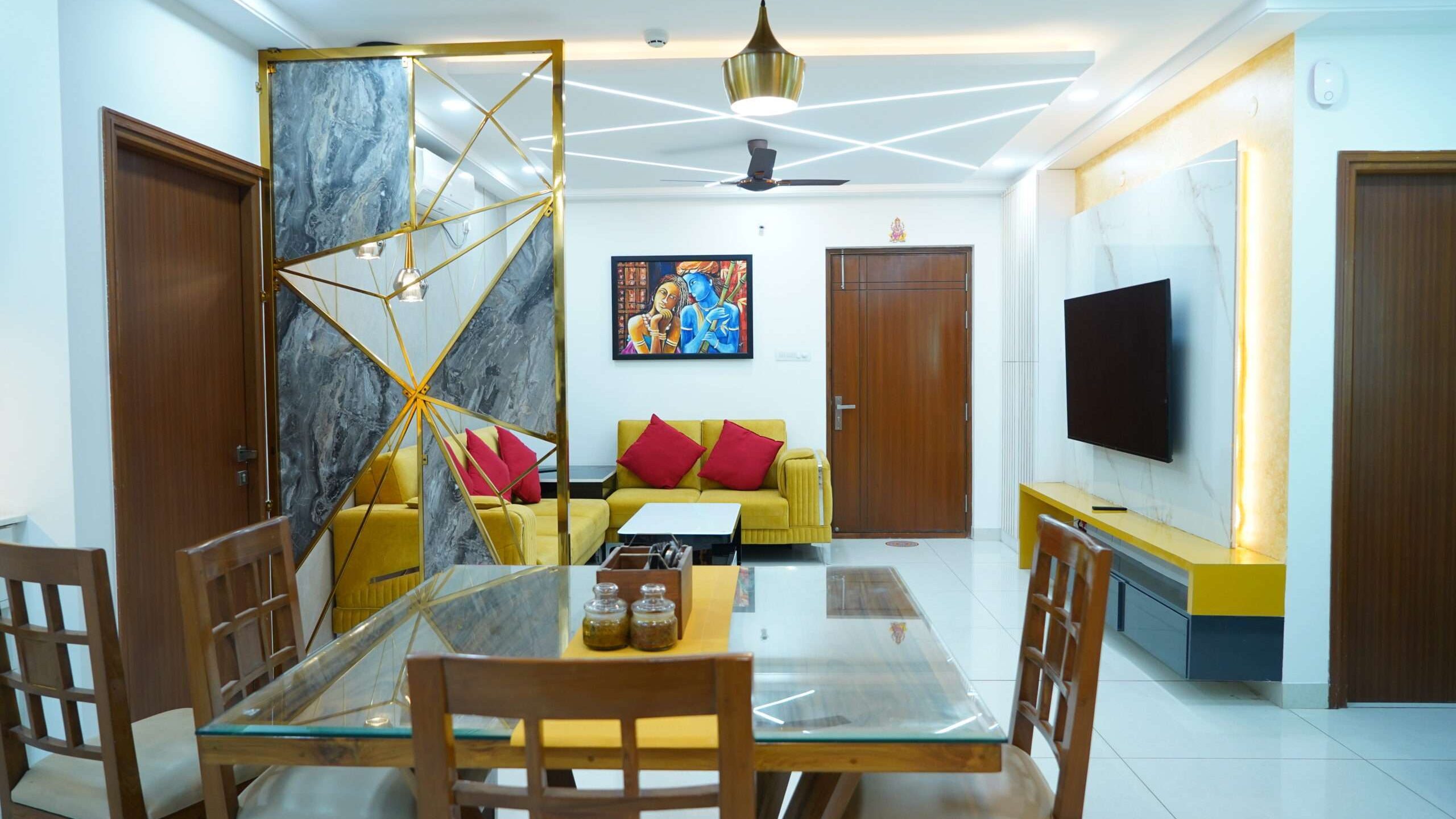 A living room with a dining table and chairs that showcases the creativity of interior designers - Aparna Sarovar Zenith - Nallagandla - Hyderabad - Dream Modular.